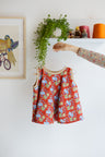 Kids organic cotton flared sweater vest.