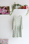 Kids long sleeve extra flared slip dress.